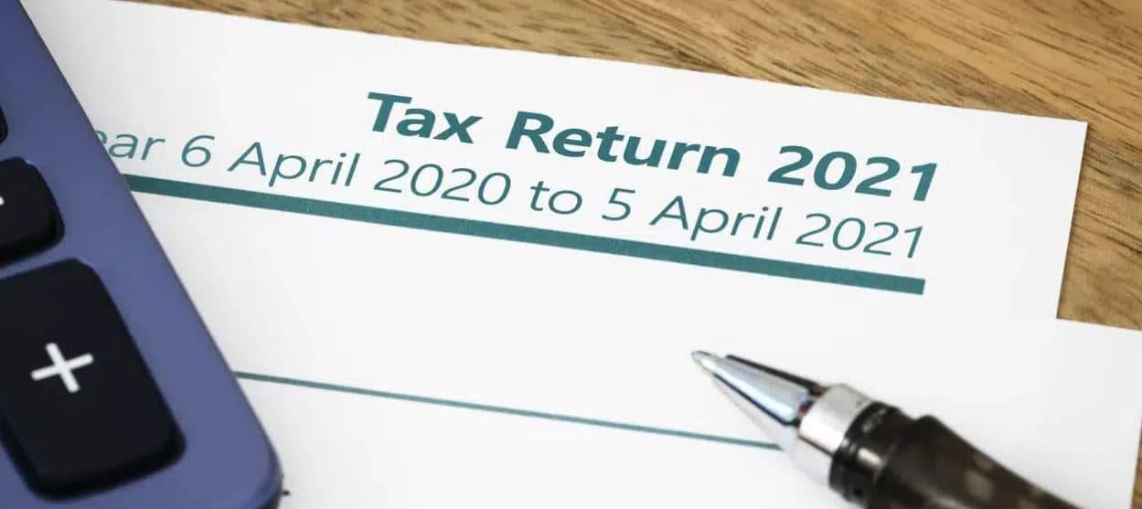tax return document and pen - what is a tax return | Taxfiler